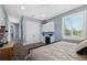 Spacious bedroom featuring grey walls, carpet, built in cabinets, and large window with blinds at 17305 Ballmont Park Dr, Odessa, FL 33556