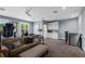 Bonus room featuring a sofa, fitness equipment and stairway with carpet flooring at 17305 Ballmont Park Dr, Odessa, FL 33556