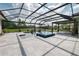 Beautiful screened-in pool with spa and ample patio space for entertaining or relaxing at 17305 Ballmont Park Dr, Odessa, FL 33556
