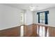 Bedroom featuring hardwood floors, ceiling fan, outdoor access, and bright window at 17812 Arbor Greene Dr, Tampa, FL 33647