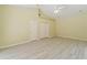 Bright bedroom with vaulted ceilings, fan, and new vinyl plank flooring at 17812 Arbor Greene Dr, Tampa, FL 33647