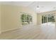 Inviting bedroom boasts plenty of natural light, vaulted ceilings, and access to the outdoor patio at 17812 Arbor Greene Dr, Tampa, FL 33647