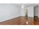 Bedroom featuring hardwood floors, ceiling fan, and ensuite access at 17812 Arbor Greene Dr, Tampa, FL 33647