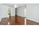 Bedroom featuring hardwood floors, ceiling fan, and ensuite access at 17812 Arbor Greene Dr, Tampa, FL 33647