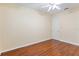 Bedroom featuring hardwood floors and door at 17812 Arbor Greene Dr, Tampa, FL 33647