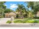 Charming single-story home featuring a well-manicured lawn and a welcoming three-car garage at 17812 Arbor Greene Dr, Tampa, FL 33647