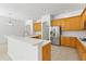 Kitchen with a large island, stainless steel appliances, and wooden cabinets at 17812 Arbor Greene Dr, Tampa, FL 33647