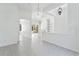Spacious living room boasting tile floors, high ceilings, and elegant chandeliers at 17812 Arbor Greene Dr, Tampa, FL 33647