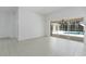 Bright living room boasts tile floors and features seamless access to the outdoor pool area at 17812 Arbor Greene Dr, Tampa, FL 33647