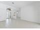 Spacious living area with tile flooring and elegant chandeliers with a decorative entry at 17812 Arbor Greene Dr, Tampa, FL 33647