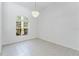 Bright room with large window and a decorative chandelier at 17812 Arbor Greene Dr, Tampa, FL 33647