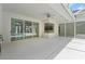 Covered patio features sliding glass doors, ceiling fan, and view of pool at 17812 Arbor Greene Dr, Tampa, FL 33647