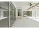 Covered patio featuring sliding glass doors and ceiling fan at 17812 Arbor Greene Dr, Tampa, FL 33647