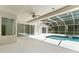 Screened-in pool area with in-ground pool, spa, and patio at 17812 Arbor Greene Dr, Tampa, FL 33647