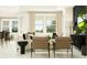 Comfortable living room with modern decor, lots of light, and stylish furnishings at 18465 Serene Lake Loop, Lutz, FL 33548