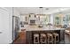 Modern kitchen with a large island, white cabinets, stainless steel appliances, and bar stool seating at 19055 Lone Creek Ct, Land O Lakes, FL 34638