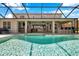 Sparkling screened-in pool with an ample patio, ideal for outdoor fun and relaxation, plus seating for gatherings at 19055 Lone Creek Ct, Land O Lakes, FL 34638
