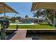 Expansive backyard with a refreshing pool and scenic water views, perfect for outdoor entertaining at 263 87Th N Ave, St Petersburg, FL 33702