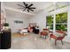 Bright bedroom with terrazzo flooring, high ceilings, and large windows offering plenty of natural light at 263 87Th N Ave, St Petersburg, FL 33702