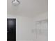 Bright bedroom featuring white walls, an open closet with white shelving, and an overhead light fixture at 263 87Th N Ave, St Petersburg, FL 33702
