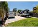 Driveway with lush greenery, RV parking and a trailer at 263 87Th N Ave, St Petersburg, FL 33702