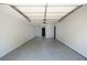 Clean and spacious garage with a sealed floor and neutral walls ready for storage or parking at 263 87Th N Ave, St Petersburg, FL 33702