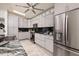 Modern kitchen features stainless steel appliances and light gray cabinets at 263 87Th N Ave, St Petersburg, FL 33702