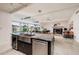 Open concept kitchen with a view of the dining and living room overlooking the water at 263 87Th N Ave, St Petersburg, FL 33702