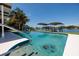 Beautiful pool with a canal view and boat dock at 263 87Th N Ave, St Petersburg, FL 33702