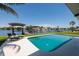 Relaxing poolside view overlooking the waterway and boat dock at 263 87Th N Ave, St Petersburg, FL 33702