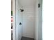 New bathroom featuring an enclosed glass door shower with white subway tile and dark hardware and accents at 263 87Th N Ave, St Petersburg, FL 33702