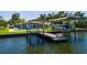 Stunning waterfront home featuring a private boat dock and boat lift, perfect for enjoying the coastal lifestyle at 263 87Th N Ave, St Petersburg, FL 33702