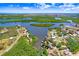 Aerial view of the home situated on a calm waterway with easy ocean access at 2635 Manatee Harbor Dr, Ruskin, FL 33570
