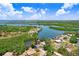 An aerial view shows the home's location near a tranquil river at 2635 Manatee Harbor Dr, Ruskin, FL 33570
