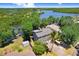 Waterfront home featuring lush landscaping and a private dock for enjoying scenic water views at 2635 Manatee Harbor Dr, Ruskin, FL 33570