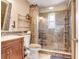 Beautiful bathroom featuring a glass shower, modern tile work, and a wood vanity at 2635 Manatee Harbor Dr, Ruskin, FL 33570