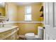 Cozy half bathroom featuring decorative trim and a marble vanity at 2635 Manatee Harbor Dr, Ruskin, FL 33570