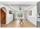 Well-lit dining room with decorative ceiling, wood floors, and modern furnishings at 2635 Manatee Harbor Dr, Ruskin, FL 33570
