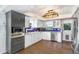 Bright, updated kitchen features white cabinets, stainless steel appliances, and modern fixtures at 2635 Manatee Harbor Dr, Ruskin, FL 33570