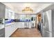 Bright, updated kitchen features white cabinets, stainless steel appliances, and modern fixtures at 2635 Manatee Harbor Dr, Ruskin, FL 33570