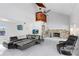 Bright living room featuring a stone fireplace, marble floors, and comfortable seating at 2635 Manatee Harbor Dr, Ruskin, FL 33570