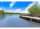 Backyard view of the waterway featuring a wooden dock at 2635 Manatee Harbor Dr, Ruskin, FL 33570