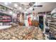 Spacious bedroom features unique car-themed decor, wood furniture, fan, and built in shelves with more car decor at 3115 W Wyoming Ave, Tampa, FL 33611