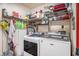 Functional laundry room with Maytag washer/dryer and ample storage shelving at 3115 W Wyoming Ave, Tampa, FL 33611