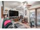 Cozy living room featuring a ceiling fan and sliding glass doors leading to the patio at 3115 W Wyoming Ave, Tampa, FL 33611