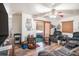 Cozy living room featuring a ceiling fan and sliding glass doors leading to the patio at 3115 W Wyoming Ave, Tampa, FL 33611