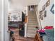 Living room featuring a staircase and views of the adjacent living area at 3115 W Wyoming Ave, Tampa, FL 33611