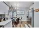 Charming dining area featuring a modern chandelier, a round table, and stylish decor accents at 3139 Pine Top Dr, Valrico, FL 33594
