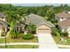 Aerial view of homes with mature trees showcasing the tranquil and well-planned community at 3254 Grassglen Pl, Wesley Chapel, FL 33544