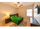 Comfortable bedroom with natural light, ceiling fan, and a gray patterned rug at 3254 Grassglen Pl, Wesley Chapel, FL 33544